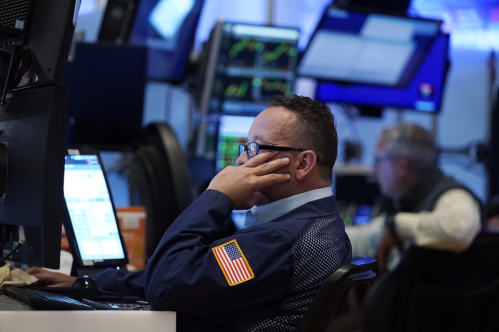 A trader works on the floor of the New York Stock Exchange, Tuesday, July 20, 2021. Stocks are opening higher on Wall Street Tuesday as investors shake off a rout a day earlier brought on by concerns about the spread of a more contagious variant of COVID-19. (AP Photo/Richard Drew)
