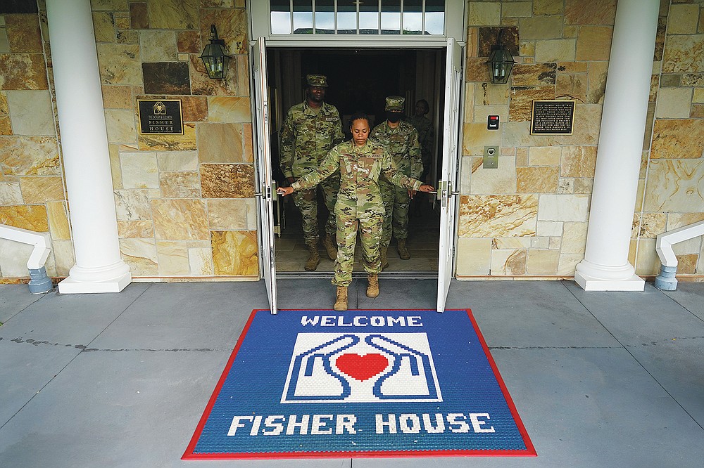 Chief Hospital Corpsman, United States Fleet Marine Forces, Jessica Zugzda  steams a dress Navy uniform in the uniform shop of the Air Force Mortuary  Affairs Operations center at Dover Air Force Base