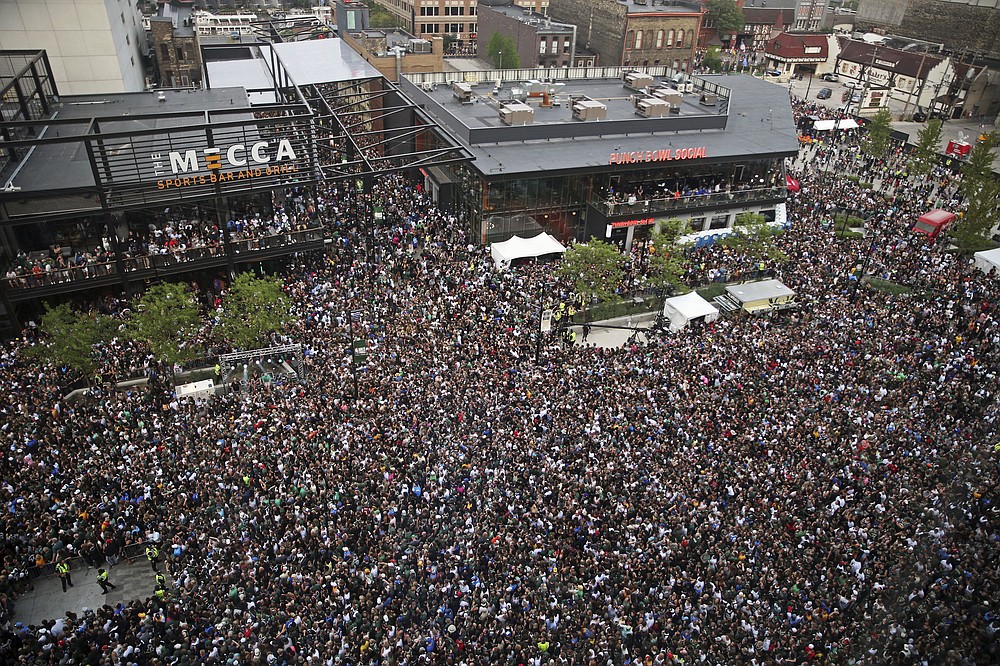 Fans gather in the Deer District for Game 6 of the NBA Finals between the Milwaukee Bucks and the Phoenix Suns at Fiserv Forum on Tuesday, July 20, 2021, in Milwaukee. (Angela Peterson/Milwaukee Journal-Sentinel via AP)