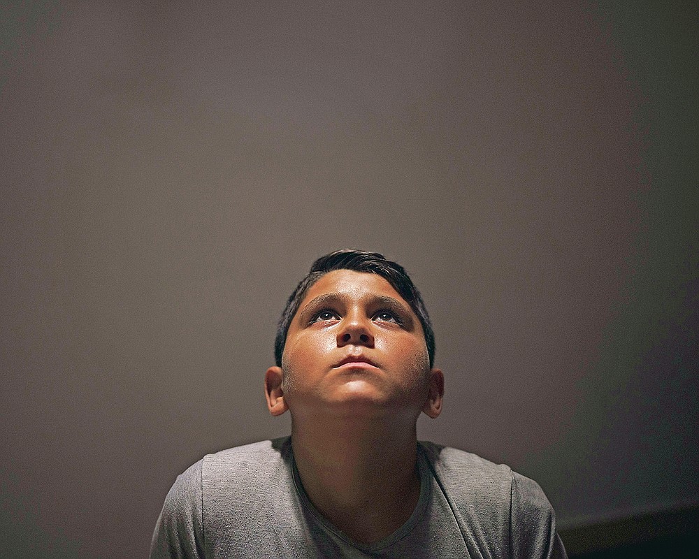 Youssef al-Madhoun, 11, poses for a portrait at his house in Beit Lahia, northern Gaza Strip, Saturday, June 19, 2021. Before the war, Youssef excelled in school and talked of one day becoming a doctor. Now, said his father, Ahmed Awad Selim al-Madhoun, he's afraid to sleep at night, afraid to step outside the house alone. He leaves the door open when he's in the bathroom. (AP Photo/Felipe Dana)