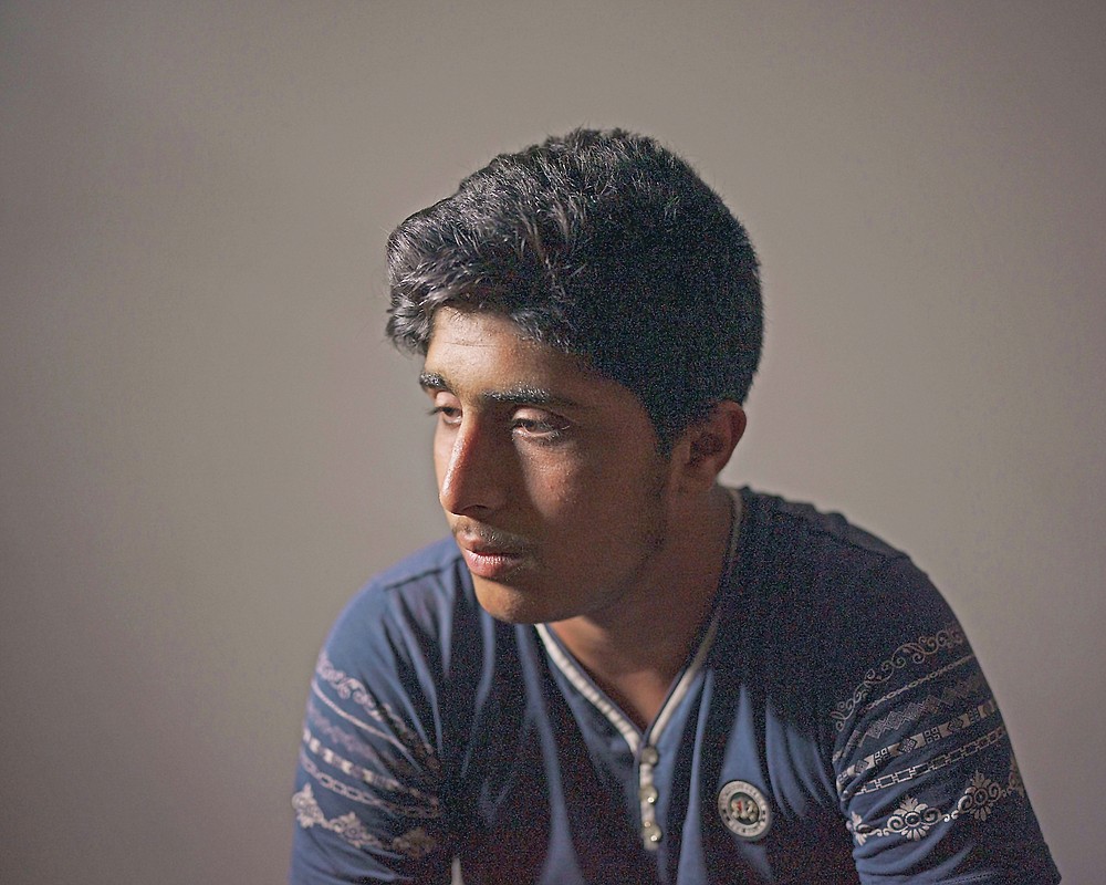 Abdullah Srour, 16, poses for a portrait in his house in Beit Lahia, northern Gaza Strip, Saturday, June 19, 2021. For years, Abdullah lived in a state of constant fear. He's survived four wars in Gaza, and with each war he grows more afraid, more insular. "After this war," says his mother, "he's regressed to a child of 5 years old." (AP Photo/Felipe Dana)