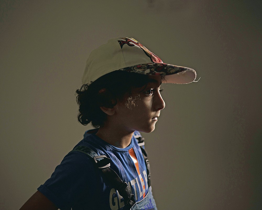Thaim Abu Oda, 5, poses for a portrait at the end of a therapy session at the Gaza Community Mental Health Programme center in Gaza City, on Thursday, June 10, 2021. For 11 days in May, the boy's life was devastated by war -- by the terrifying boom of fighter jets overhead and the bombs that shook his neighborhood. He stopped eating. He lost more than 5 kilograms (11 pounds). His face became gaunt and his ribs protruded. He lost sleep, too, especially after hearing his grandfather had survived an airstrike on his building and had been hospitalized for breathing problems. (AP Photo/Felipe Dana)