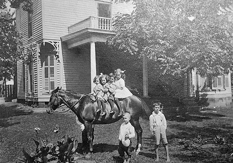 Irene Rosenzweig is seated on the horse (second from the left) at a family gathering during the early 1900s. (Special to The Commercial/Butler Center for Arkansas Studies)