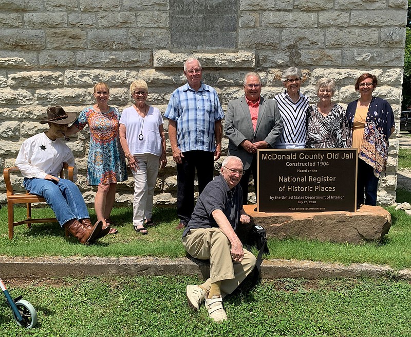 ALEXUS UNDERWOOD/SPECIAL TO MCDONALD COUNTY PRESS Pictured are community members, historical society members, and volunteers that were a part of the process of the McDonald County Old Jail being added to the National Register of Historical Places. The late Gene Hall is not pictured, although he played an instrumental role in naming the jail a historic location.