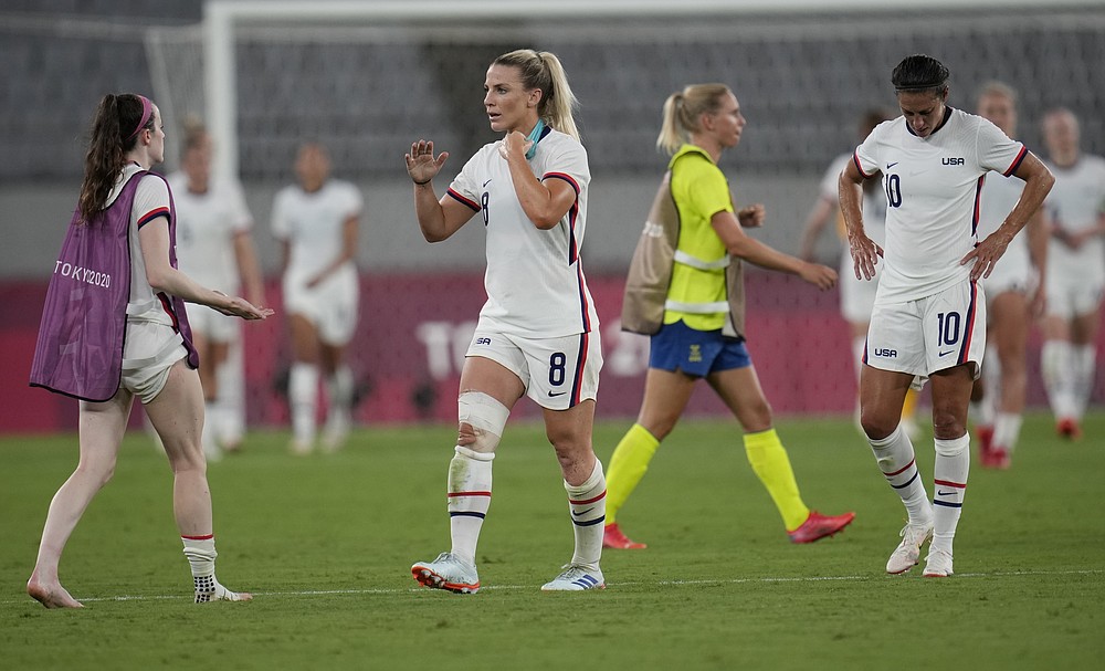 United States' players leave the field after losing 0-3 against Sweden during a women's soccer match at the 2020 Summer Olympics, Wednesday, July 21, 2021, in Tokyo. (AP Photo/Ricardo Mazalan)
