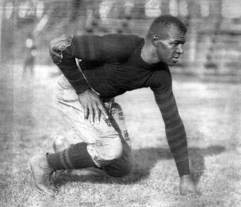 Frederic "Duke" Slater poses for a photo in 1921 when he was a tackle on the University of Iowa football team. Slater was the NFL’s first African-American lineman, and often the only Black player on the field. After retiring, he broke down more racial barriers to become a judge in Chicago. (Chicago Sun-Times via AP)