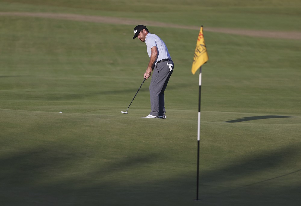 South Africa's Louis Oosthuizen puts on the 18th green during the third round of the British Open Golf Championship at Royal St George's golf course Sandwich, England, Saturday, July 17, 2021. (AP Photo/Ian Walton)