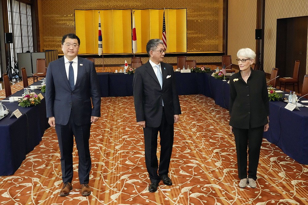 U.S. Deputy Secretary of State Wendy Sherman, right, South Korean First Vice Foreign Minister Choi Jong Kun, left, with Japanese Vice-Minister for Foreign Affairs Takeo Mori, center, pose for photographers prior to their trilateral meeting at the Iikura Guesthouse Wednesday, July 21, 2021, in Tokyo. (AP Photo/Eugene Hoshiko)