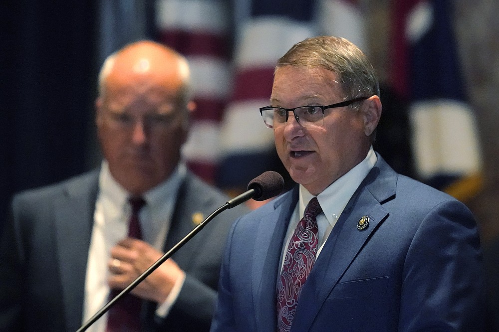 Senate President Page Cortez speaks at the start of a veto session in Baton Rouge, La., Tuesday, July 20, 2021. Behind him is Sen. Jay Morris, R-Monroe. Louisiana state senators have narrowly voted to overturn Democratic Gov. John Bel Edwards' rejection of a bill prohibiting transgender students from participating in school sports. The vote came Tuesday on the opening day of the first veto session under the state's nearly 50-year-old constitution. (AP Photo/Gerald Herbert)