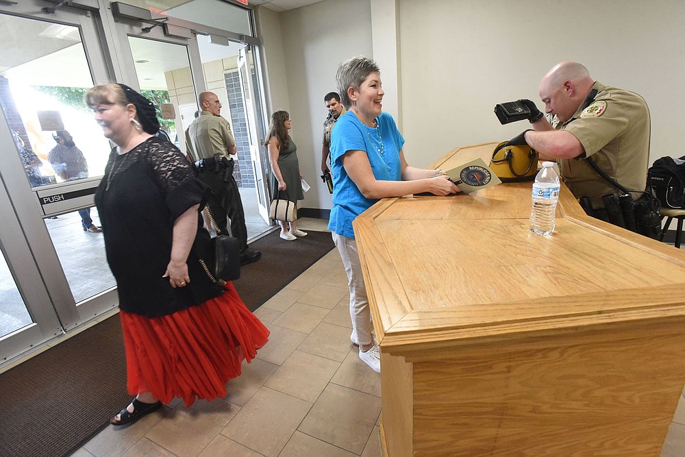 Benton County deputies search bags Tuesday July 20 2021 of people attending the pro-life resolution at Northwest Arkansas Community College.
(NWA Democrat-Gazette/Flip Putthoff)