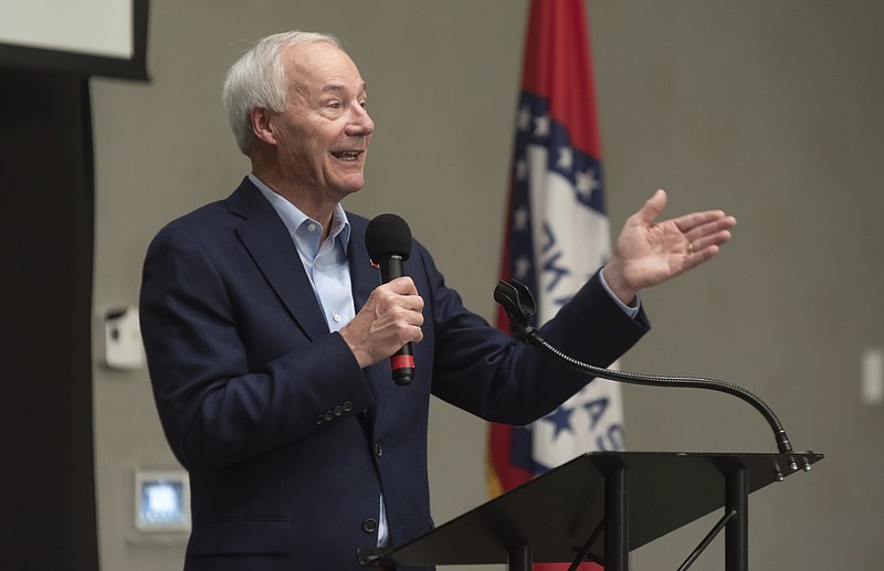 In this July 15, 2021, file photo, Arkansas Gov. Asa Hutchinson speaks during a town hall meeting in Texarkana, Ark. A group of Democratic lawmakers in Arkansas, which has the nation's highest COVID-19 rate, urged the governor and Republicans who control the Legislature on Thursday, July 22, 2021, to lift the state's ban on schools and government entities requiring people to wear masks. (Kelsi Brinkmeyer/The Texarkana Gazette via AP, File)