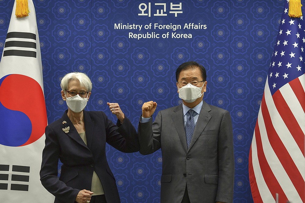U.S. Deputy Secretary of State Wendy Sherman bumps elbows with South Korean Foreign Minister Chung Eui-yong prior to their meeting at Foreign Ministry in Seoul, South Korea, Thursday, July 22, 2021. The United States, Japan and South Korea on Wednesday reaffirmed their commitment to work together on North Korea's denuclearization and other regional threats but made no progress in bringing closer together the two U.S. allies. (Song Kyung-seok/Pool Photo via AP)