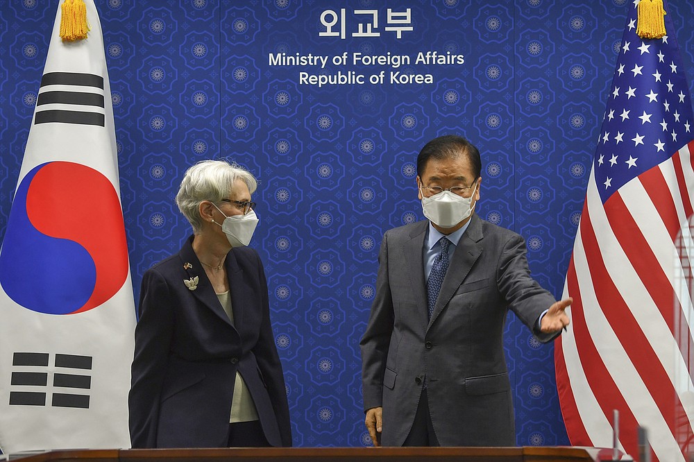 South Korean Foreign Minister Chung Eui-yong gestures to U.S. Deputy Secretary of State Wendy Sherman prior to their meeting at Foreign Ministry in Seoul, South Korea, Thursday, July 22, 2021. The United States, Japan and South Korea on Wednesday reaffirmed their commitment to work together on North Korea's denuclearization and other regional threats but made no progress in bringing closer together the two U.S. allies. (Song Kyung-seok/Pool Photo via AP)