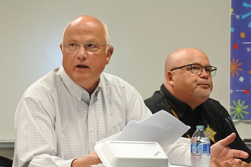 Sebastian County Judge David Hudson, left, provides a review of the county justice system and jail needs assessment project while Sheriff Hobe Runion, right, listens during the Sebastian County Criminal Justice Coordinating Committee meeting Thursday. 
(NWA Democrat-Gazette/Thomas Saccente)