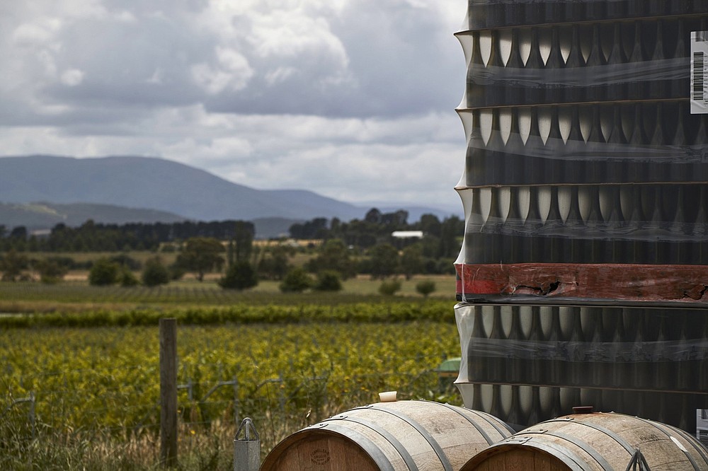 Wine barrels and pallets of bottles stacked at a winery in the Yarra Valley, Victoria, Australia, on Dec. 7, 2020. MUST CREDIT: Bloomberg photo by James Bugg.