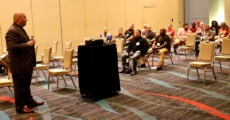 White Hall School Resource Officer Brian Todd (front row) attends Dealing with Adolescent Grief Issues presented by Dr. John E. Beckwith Jr (left), a 34-year Texas licensed funeral director, embalmer and owner of Golden Gate Funeral Home. (Pine Bluff Commercial/Eplunus Colvin)