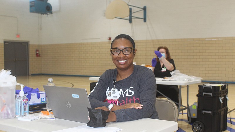 UAMS staff member Sabrina Mallet ran the COVID-19 vaccine clinic hosted by the Boys and Girls Club of El Dorado on Saturday. (Matt Hutcheson/News-Times)