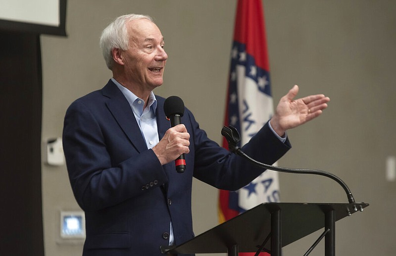 In this July 15, 2021, file photo, Arkansas Gov. Asa Hutchinson speaks during a town hall meeting in Texarkana, Ark.  Facing growing vaccine hesitancy, governors in states hard hit by the coronavirus pandemic are asking federal regulators to grant full approval to the shots in the hope that will persuade more people to get them. The governors of Arkansas and Ohio have appealed in recent days for full approval as virus cases and hospitalizations skyrocket in their states. (Kelsi Brinkmeyer/The Texarkana Gazette via AP, File)