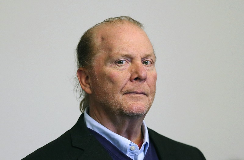 FILE - In this May 24, 2019, file photo, celebrity chef Mario Batali is arraigned on a charge of indecent assault and battery in Boston Municipal Court in Boston, in  connection with a 2017 incident at a Boston restaurant. New York's attorney general Letitia James announced a $600,000 settlement with Batali and his former business partner Joseph Bastianich after investigators alleged a hostile work environment at their restaurants. (David L Ryan/The Boston Globe via AP, Pool, File)