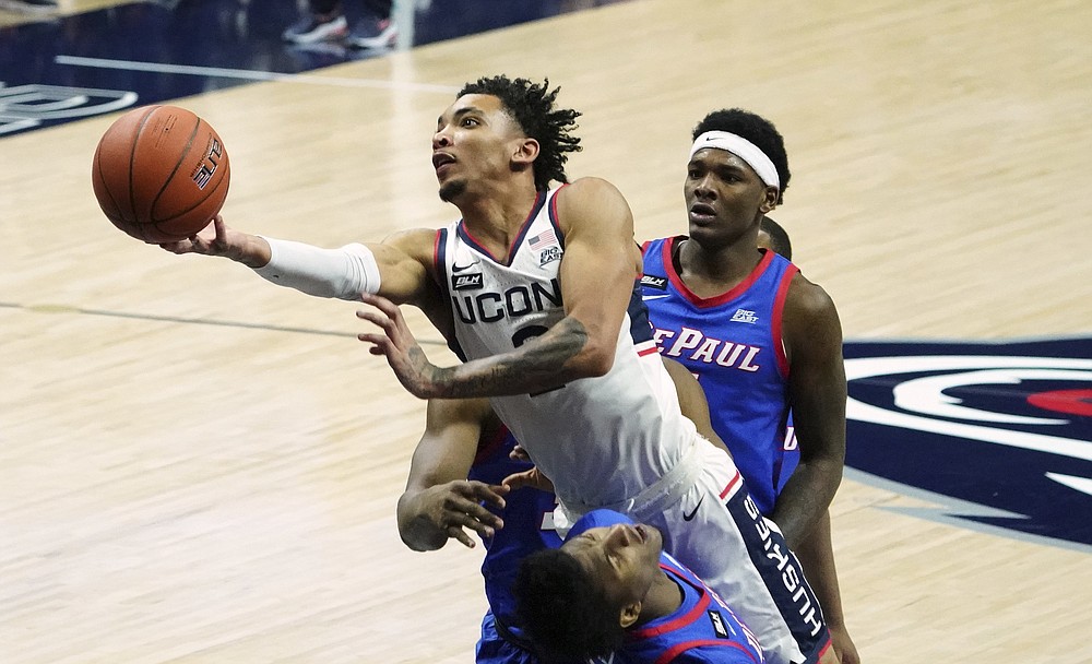 FILE - In this Dec. 30, 2020, file photo, Connecticut guard James Bouknight (2) shoots against DePaul during the first half of an NCAA college basketball game in Storrs, Conn. (David Butler II/Pool Photo via AP, File)