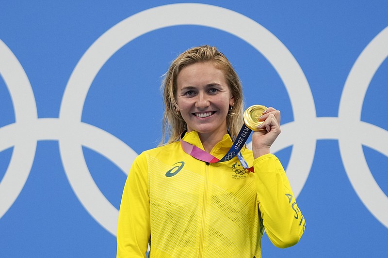 Ariarne Titmus, of Australia, holds up her medal Monday after winning the final of the women's 400-meters freestyle at the 2020 Summer Olympics in Tokyo. - Photo by Matthias Schrader of The Associated Press