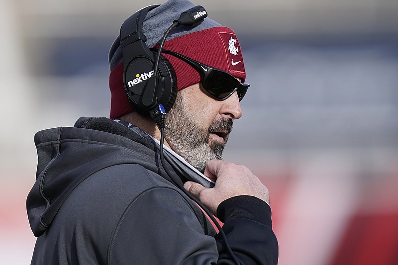 FILE - Washington State head coach Nick Rolovich looks on during the first half of an NCAA college football game against Utah in Salt Lake City, in this Saturday, Dec. 19, 2020, file photo. Rolovich has become the story of Pac-12 media day even though he won't be in attendance. Rolovich's announcement last week he has chosen not to receive a COVID-19 vaccination has divided his fan base and seemingly his school as one of the colleges requiring students and staff to be vaccinated before the start of classes this fall. (AP Photo/Rick Bowmer, File)