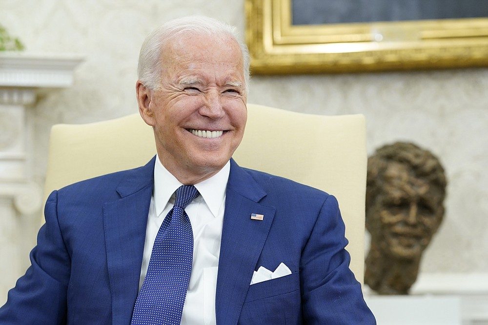 President Joe Biden smiles during his meeting with Iraqi Prime Minister Mustafa al-Kadhimi in the Oval Office of the White House in Washington, Monday, July 26, 2021. (AP Photo/Susan Walsh)
