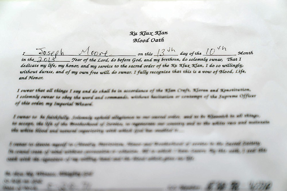 A KKK "blood oath" signed by Joseph Moore is photographed at the Columbia County Courthouse in Lake City, Fla., Friday, April 16, 2021. On Jan. 30, 2015, less than two years after Moore had signed it, a murder plot with other klansmen was in motion, and he was involved. (AP Photo/David Goldman)