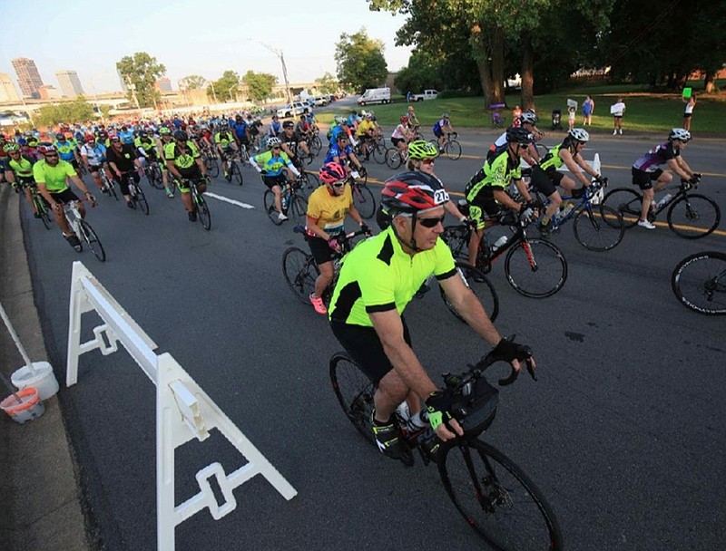 Cyclists roll in North Little Rock on June 1, 2019, not long after starting their section of the pre-pandemic 16th annual CARTI Tour de Rock.
(Democrat-Gazette file photo/STATON BREIDENTHAL)