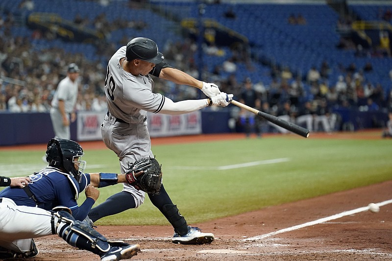 New York Yankees' Aaron Judge connects for an RBI single off Tampa Bay Rays relief pitcher Pete Fairbanks during the 10th inning of a baseball game Wednesday, July 28, 2021, in St. Petersburg, Fla. (AP Photo/Chris O'Meara)
