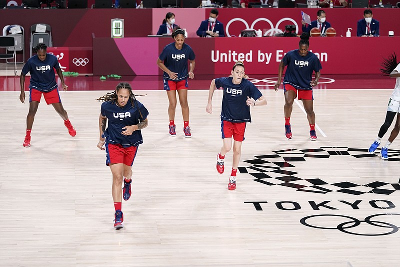 United State's Brittney Griner and Breanna Stewart warm up with teammates Tina Charles, rear left, A'ja Wilson and Sylvia Fowles, rear right, before a women's basketball preliminary round game against Nigeria at the 2020 Summer Olympics, Tuesday, July 27, 2021, in Saitama, Japan. The U.S. has an embarrassment of riches when it comes to talented post players, possibly the best ever assembled. (AP Photo/Charlie Neibergall)