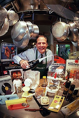 Ron Popeil, founder of Ronco Industries, poses with some of his products in the kitchen of his Los Angeles home in March 1999.
(Chicago Tribune/TNS/David McNew)