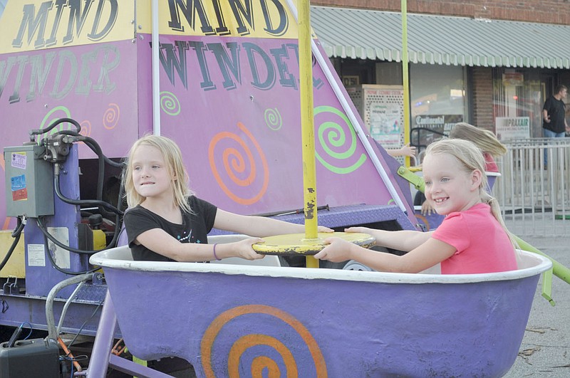 FILE PHOTO Two girls enjoy a ride at the carnival during the 2019 Jesse James Days in Pineville. Last year's event was canceled due to the covid-19 pandemic, but this year's event will be Aug. 18-21.