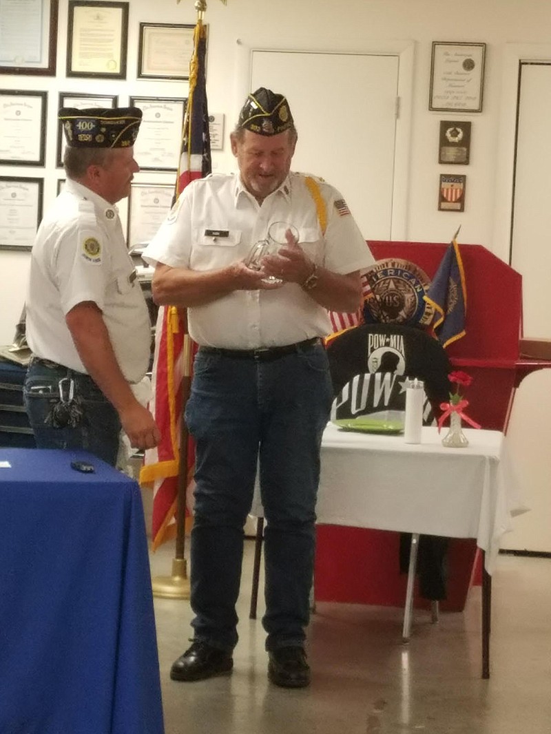 PHOTO SUBMITTED Dennis Kirk and Commander of Post 392, Tim McCaine. McCaine presented Kirk with a mug showcasing his navy retirement rank.
