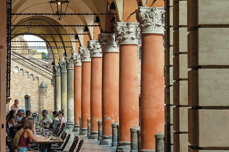A view of Bologna's porticoes in Bologna, Italy,  Wednesday, July 28, 2021. Bologna's 12th-century porticoes, still part of the city's everyday life, have been added to the World Heritage List. At a meeting in China on Wednesday, the World Heritage Committee of UNESCO, the U.N. culture agency, inscribed the porticoes on the prestigious list. The addition raises to 58 the number of Italian sites on the list. (Guido Calamosca/LaPresse via AP)