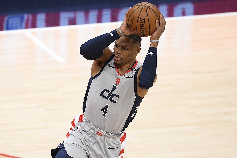 FILE - In this May 29, 2021, file photo, Washington Wizards guard Russell Westbrook works with the ball in Game 3 in a first-round NBA basketball playoff series against the Philadelphia 76ers in Washington. 
(AP Photo/Nick Wass, File)