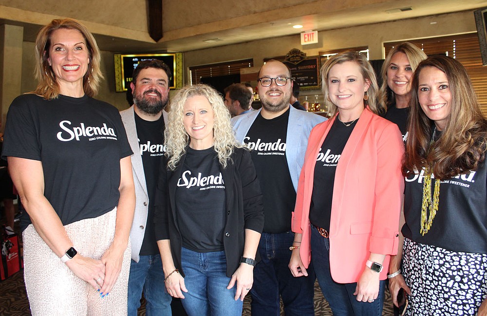 Kiss a Pig candidate Chandra McFarlane (from left), Houston Files, Davina Collins, Jared McKinney, Karen Anaya, Jennifer Ring and Kim Charlton gather at the NWA ADA preview party.
(NWA Democrat-Gazette/Carin Schoppmeyer)