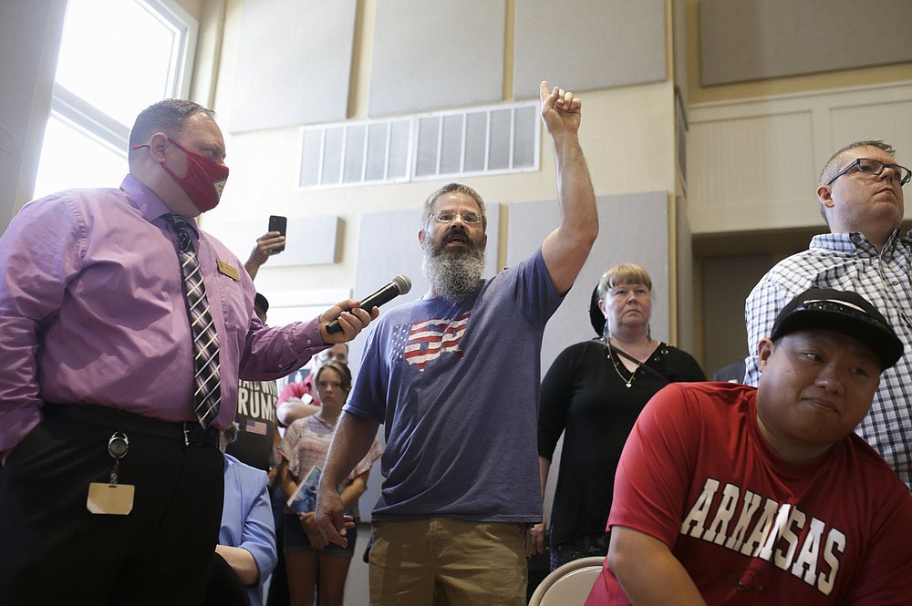 Tom Mulcahy of Springdale expresses his perspective about the covid-19 vaccine to Gov. Hutchinson, Friday, July 30, 2021 at the American Legion Community Hall in Siloam Springs. Gov. Hutchinson visited Siloam Springs for the final stop in his series of community conversation about the covid vaccine. Check out nwaonline.com/210731Daily/ for today's photo gallery.
(NWA Democrat-Gazette/Charlie Kaijo)