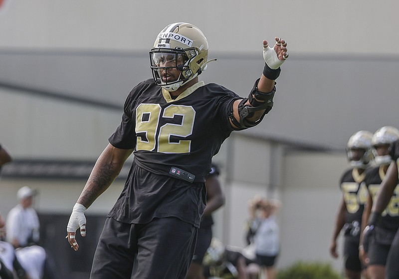 New Orleans Saints defensive end Marcus Davenport (92) stretches Friday during NFL training camp in Metairie. - Photo by Derick Hingle of The Associated Press