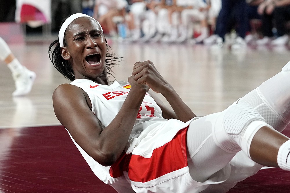 Spain's Astou Ndour (45) celebrates a play during a women's basketball game against Serbia at the 2020 Summer Olympics, Thursday, July 29, 2021, in Saitama, Japan. (AP Photo/Eric Gay)