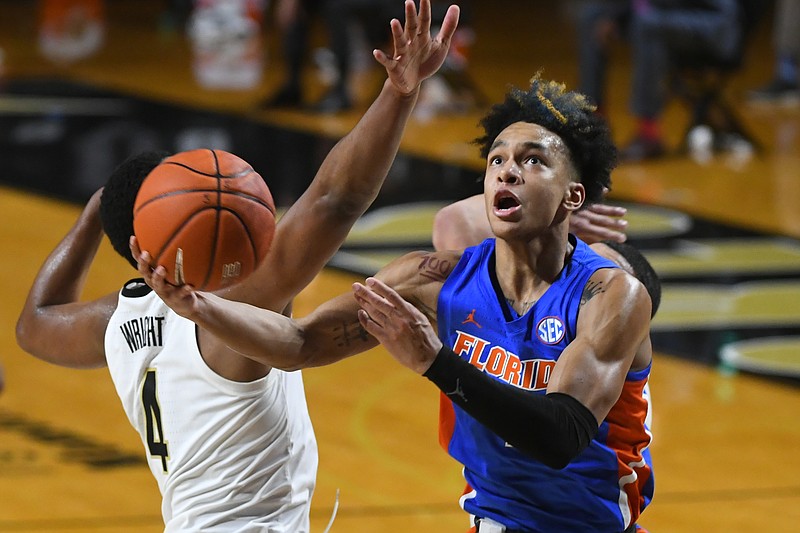 FILE - In this Dec. 30, 2020, file photo, Florida guard Tre Mann shoots as Vanderbilt guard Jordan Wright defends during an NCAA college basketball game in Nashville, Tenn. Mann was selected by the Oklahoma City Thunder in the NBA draft Thursday, July 29. (AP Photo/John Amis, File)