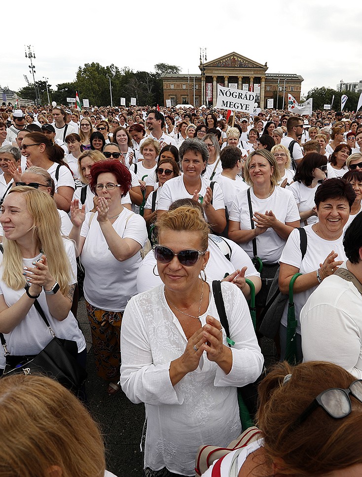 Several thousand healthcare workers and supporters protest to demand wage increases and better working conditions in Budapest, Hungary, Saturday, July 31, 2021. The protesters, including supporters from many other Hungarian trade unions, have said the COVID-19 pandemic had only worsened their situation while their pay had remained low. (AP Photo/Laszlo Balogh)