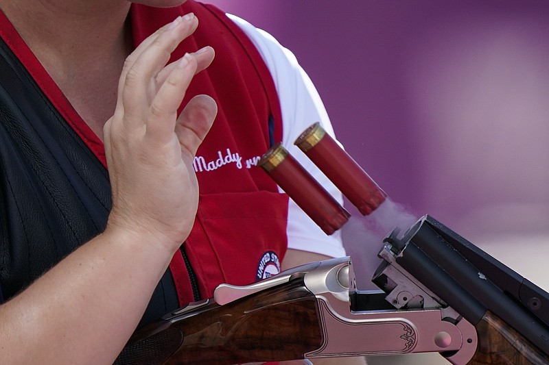 FILE - In this Thursday, July 22, 2021, file photo, Madelynn Ann Bernau, of the United States, ejects her shells during practice at the Asaka Shooting Range ahead of the 2020 Summer Olympics in Tokyo, Japan. The COVID-19 pandemic coupled with record sales of firearms have created a shortage of ammunition in the United States that has impacting competition and recreational shooters, hunters, people seeking personal protection and law enforcement agencies. (AP Photo/Alex Brandon, File)