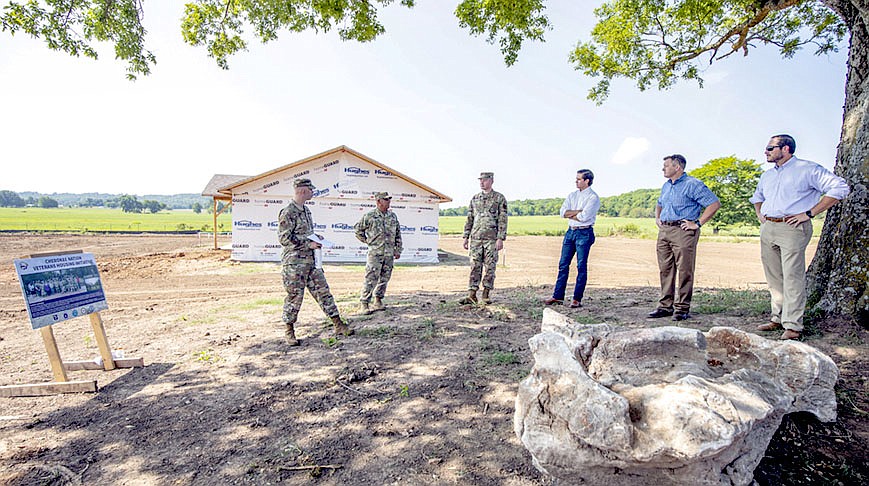 Photo Submitted Deputy Chief Bryan Warner and Chief of Staff Todd Enlow toured the site of 21 new Cherokee veteran houses being built through a joint effort with the U.S. Department of Defense Innovative Readiness Training program. Seven are being built in the first year of the project.