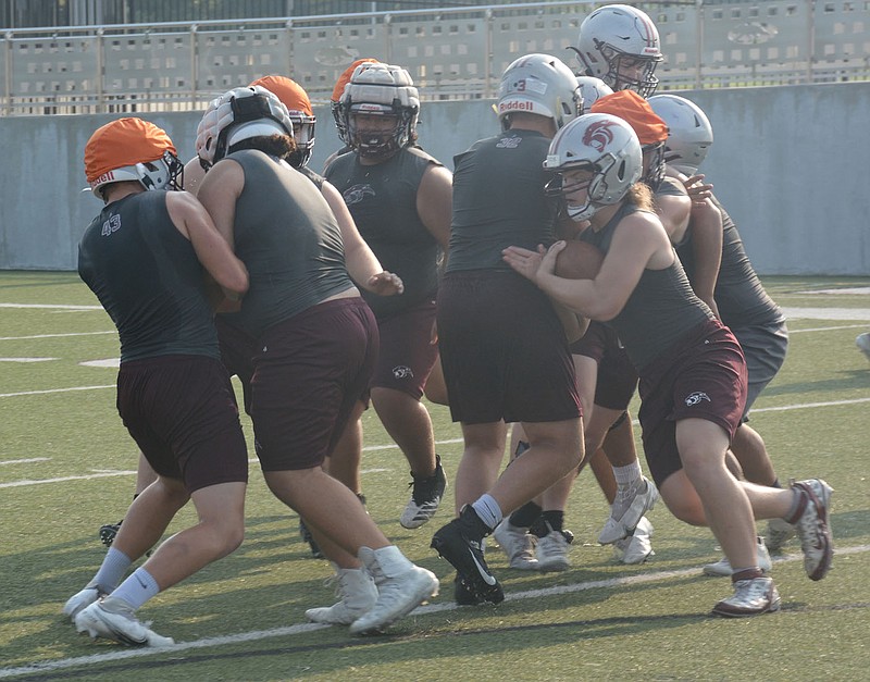 Graham Thomas/Herald-Leader
Sophomore running back Jed Derwin looks for a running lane during Siloam Springs football practice Monday at Panther Stadium.