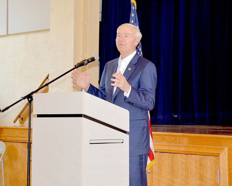 Marc Hayot/Herald-Leader Governor Asa Hutchinson speaks about the importance of getting vaccinated on Friday at the Siloam Springs community building. Hutchinson came to Siloam Springs as part of his "Covid Conversations" series to encourage Arkansans to get the vaccine but faced strong opposition from a portion of the audience.