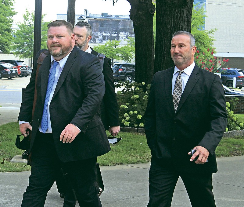 Franklin County Sheriff Anthony Boen (right) walks into the federal courthouse for the Western District of Arkansas on Monday with his attorneys, Russell Wood (left) and Paul Prater (center), in Fort Smith. Boen is on trial for three charges of deprivation of rights under color of law in connection with three use of force incidents involving detainees.
(NWA Democrat-Gazette/Max Bryan)
