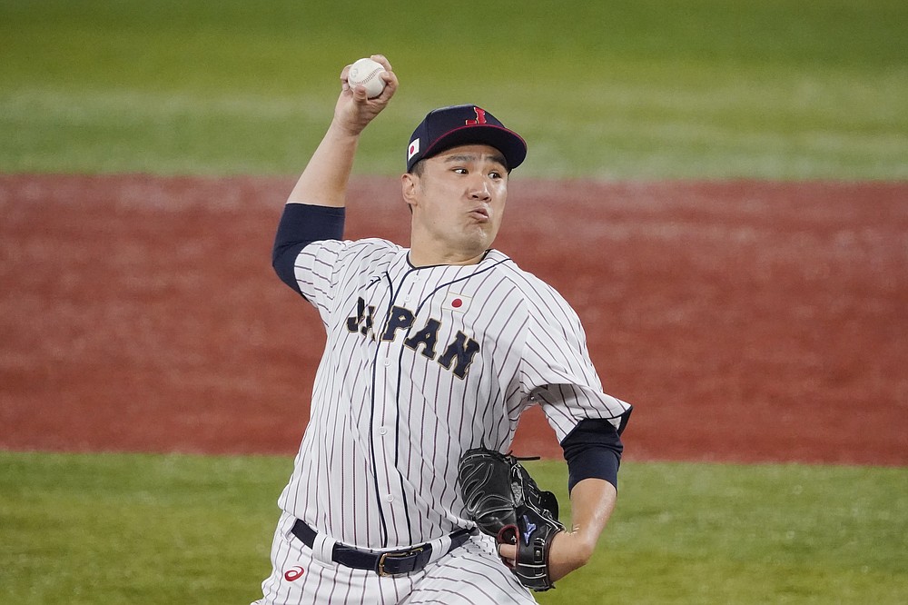 Japan's Masahiro Tanaka pitches during the third inning of a baseball game against the United States at the 2020 Summer Olympics, Monday, Aug. 2, 2021, in Yokohama, Japan. (AP Photo/Sue Ogrocki)