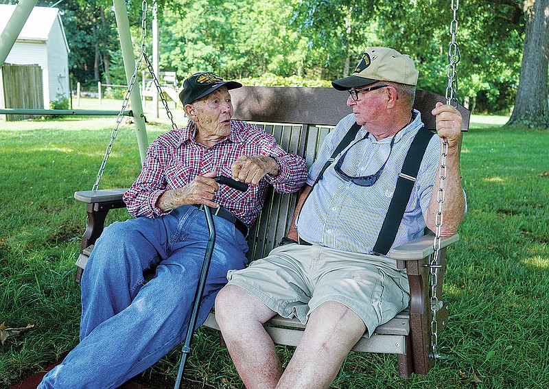 World War II veteran Beverly Salyards, left, sits with Vietnam veteran Larry Ritchie, right, at Ritchie's home in Rockingham County, Va. The veterans met each other at a Disabled American Veterans meeting 20 years ago and have been close friends ever since. (Jessica Wetzler/Daily News-Record via AP)