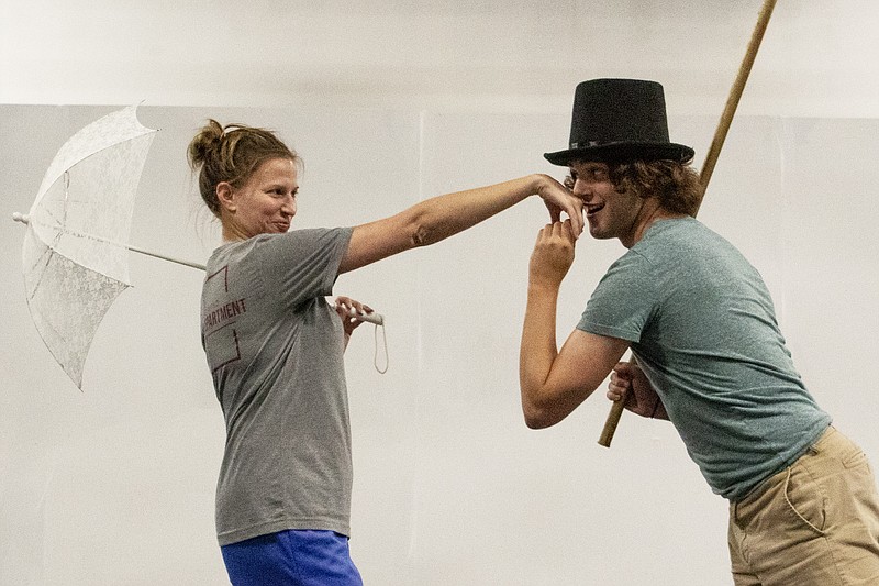 Alex Armstrong, who plays Dodger, kisses Margaret Graham's hand during the number "I'd Do Anything" as part of rehearsal for Capital City Productions' upcoming show, "Oliver!" Graham plays Nancy in the play. Charlotte Renner/For the News Tribune